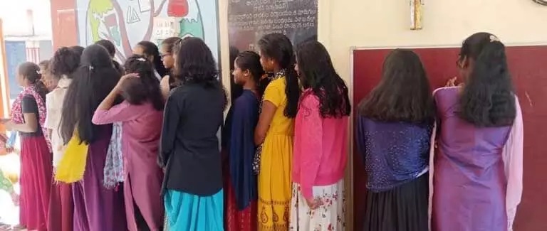 Principal Cut Student’s Hair 